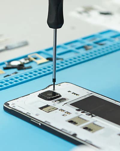 Technician repairing mobile phone - Vrepairs Bangalore
