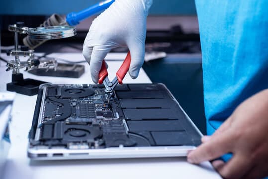 Technician repairing mobile phone - Vrepairs Bangalore